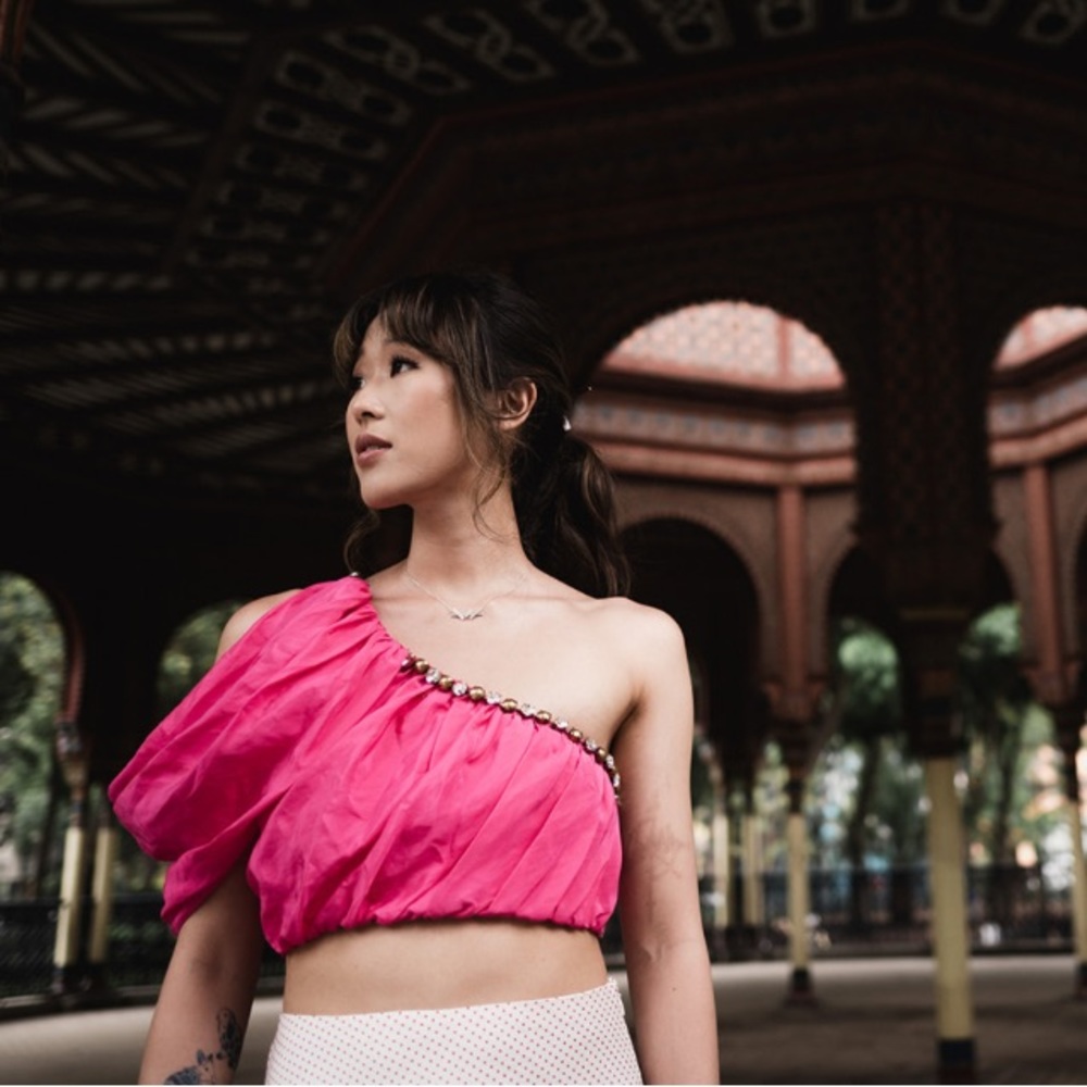 Area NYC magenta pink one shoulder rhinestone embellished crop top